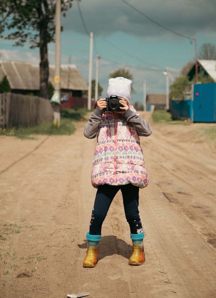 Girl Taking Picture Outdoor With Professional Camera