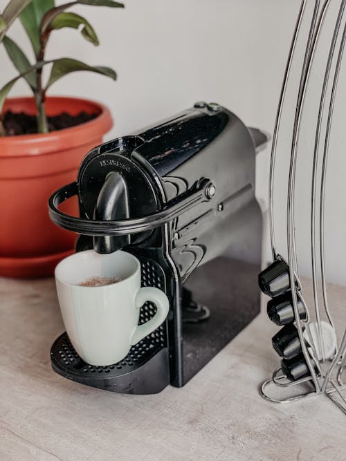 A Mug of Coffee on Coffee Maker