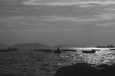 A fishing boat at dusk on open water, photo by Emre Yaşar on Pexels