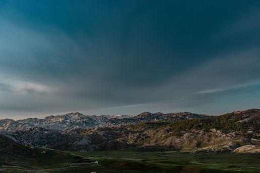 A vast scenic mountain view under a clear blue sky in Nikšić, Montenegro.
