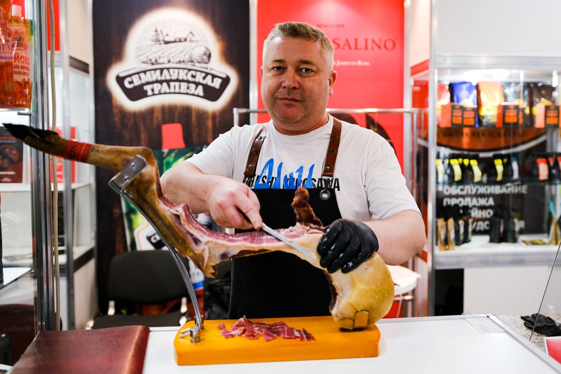 A Butcher Cutting Meat · Free Stock Photo