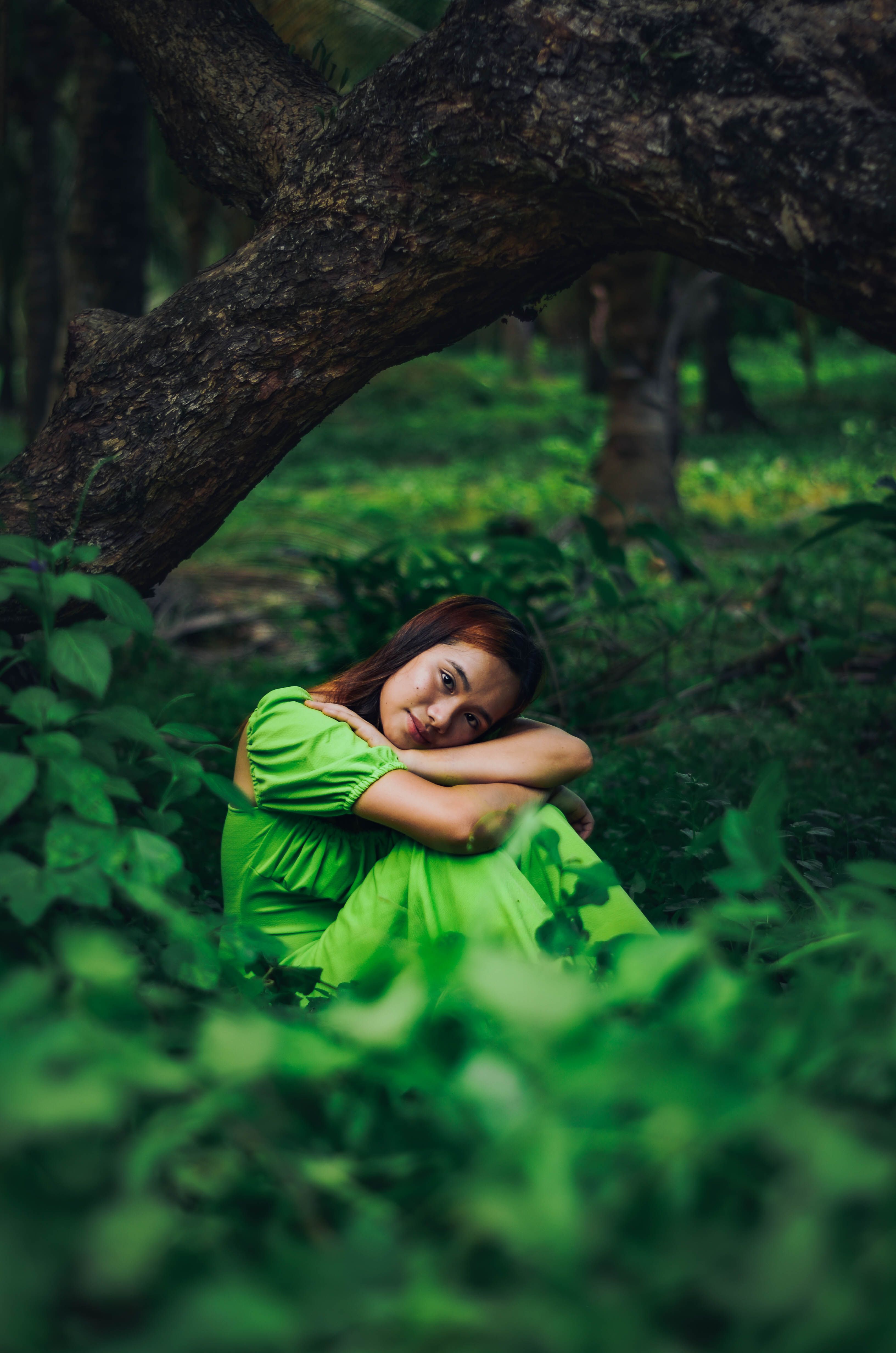 Girl in a Green Dress amidst Leaves · Free Stock Photo