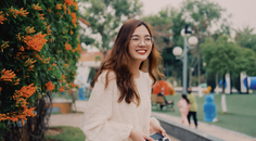 radiant white dress girl frolicking in the park