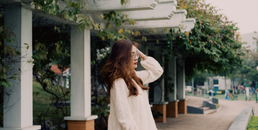 radiant white dress girl frolicking in the park