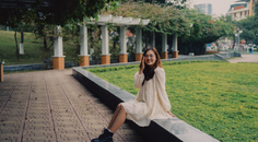 radiant white dress girl frolicking in the park