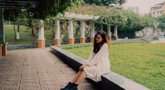 radiant white dress girl frolicking in the park