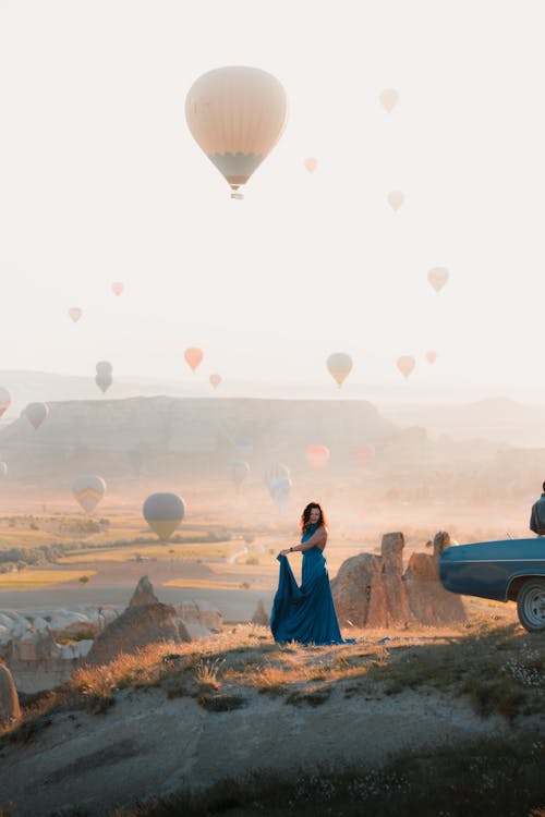 Woman in Blue Dress Posing Against Balloons