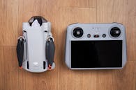 Drone dji mini 3 Pro on a Wooden Surface