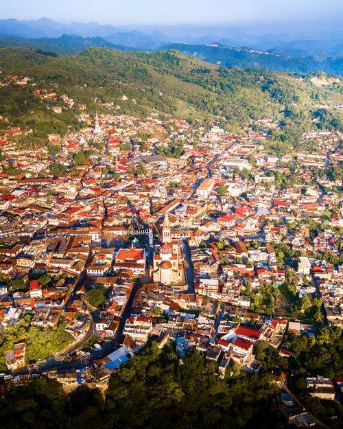 Free Stunning aerial perspective of Cuetzalan, Mexico, showcasing the town's charm and natural surroundings. Stock Photo