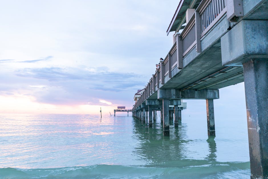 partnership opportunities for US travel agencies mexico - Stunning sunset at Clearwater Beach Pier with calm ocean waters and pastel skies.