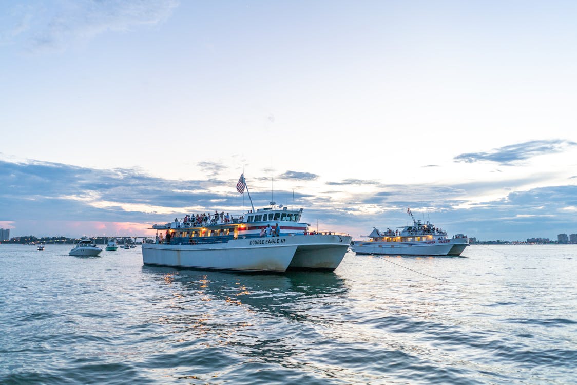 Two Yachts Floating on Body of Water