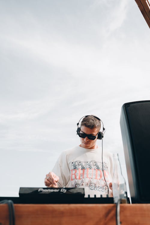 Photo of a DJ Wearing Headphones