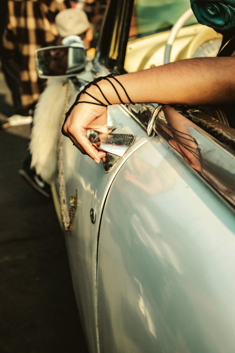 Hand Holding Car Door Handle