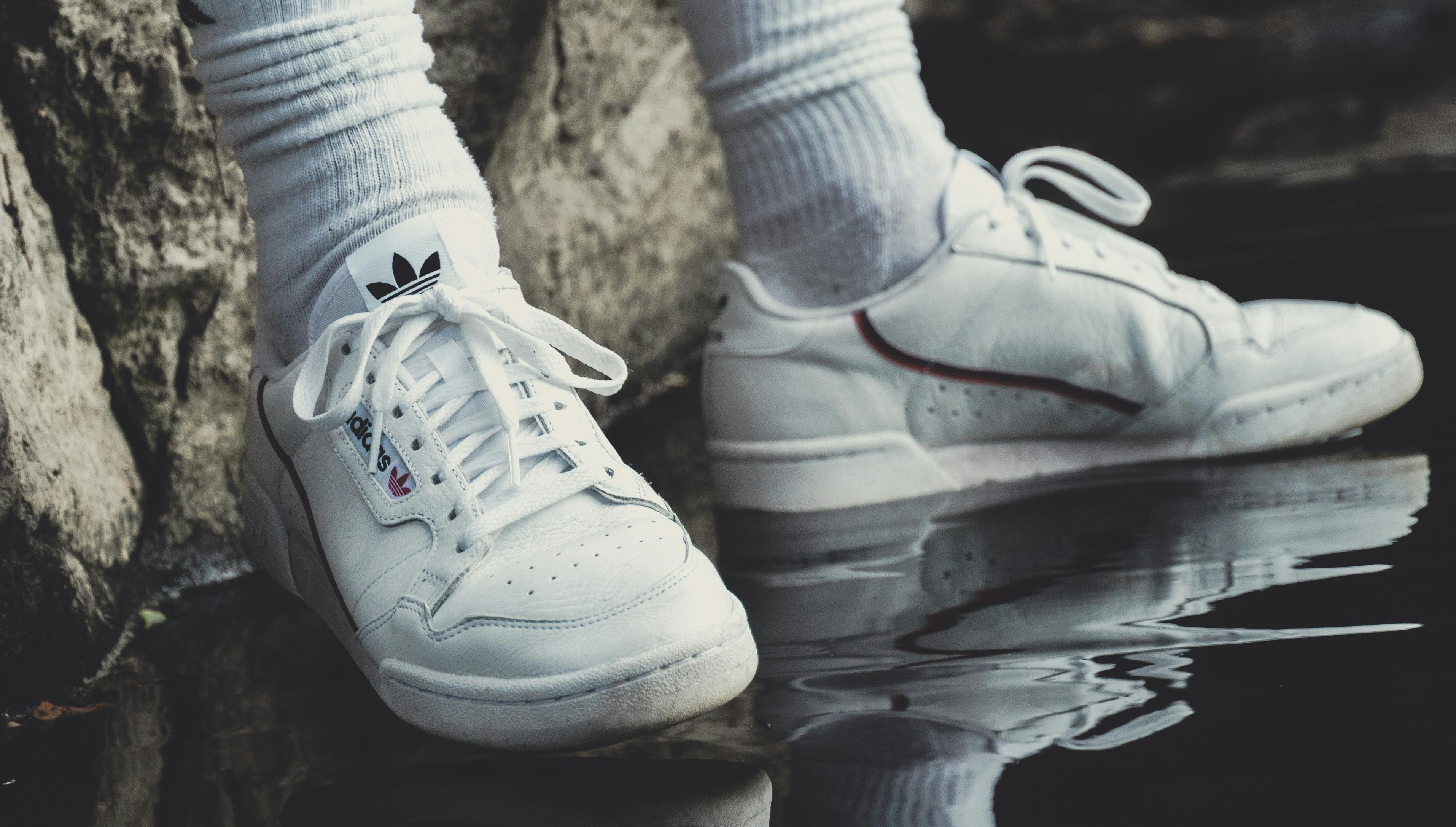 Person Wearing White Adidas Shoes · Free Stock Photo