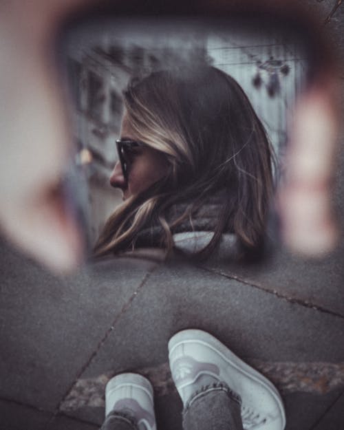 Reflection of a Woman in a Mirror