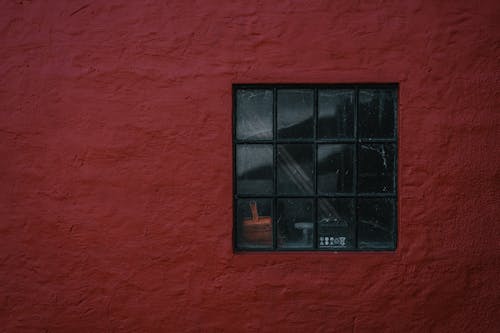 Free A Glass Windows on a Red Concrete Wall Stock Photo