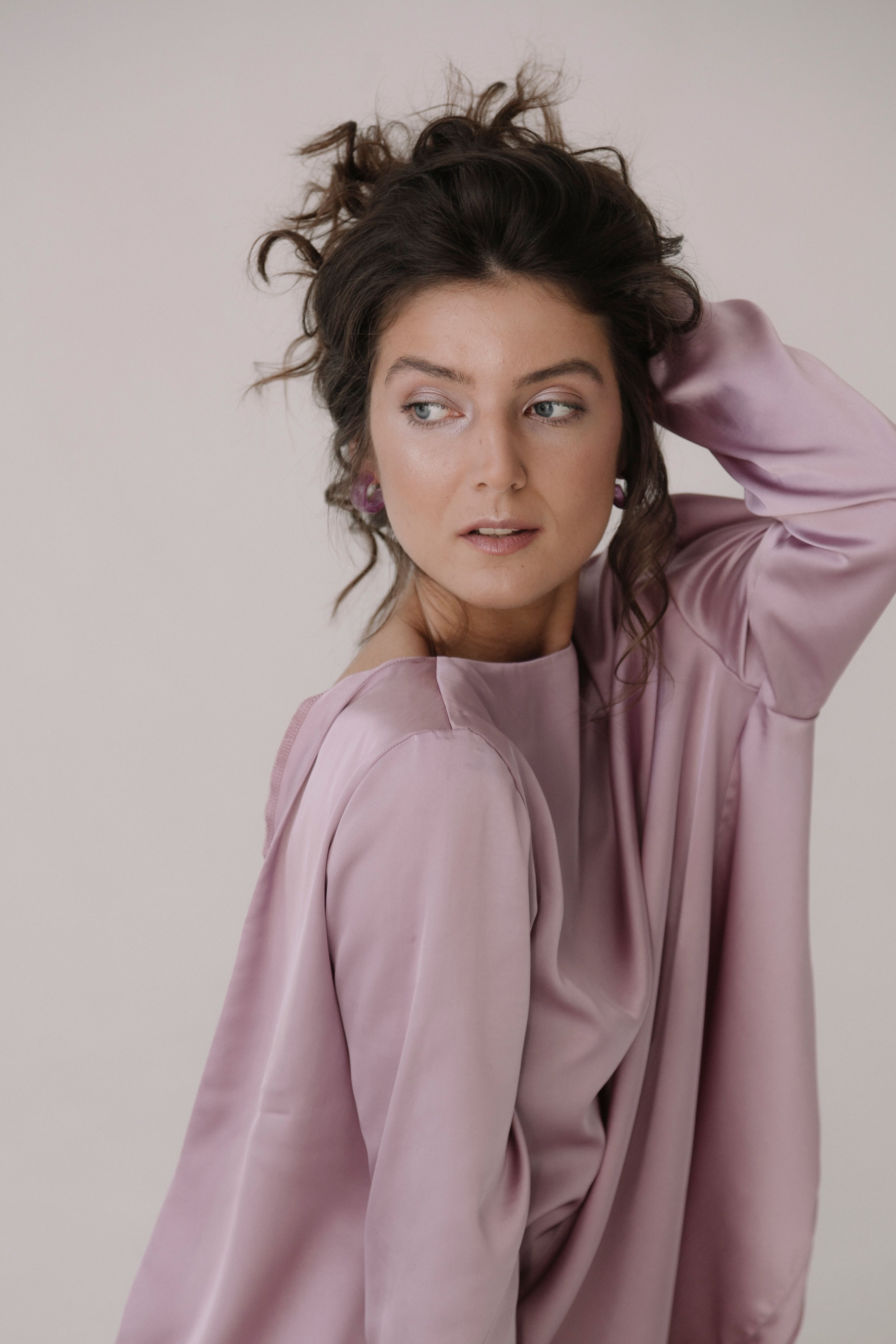 Woman in Pink Long Sleeve Shirt Posing · Free Stock Photo