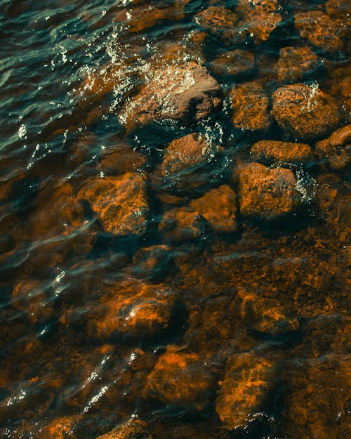 Free Brown and Gray Rocks on Body of Water Stock Photo