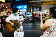 Man in White T-shirt Playing Acoustic Guitar