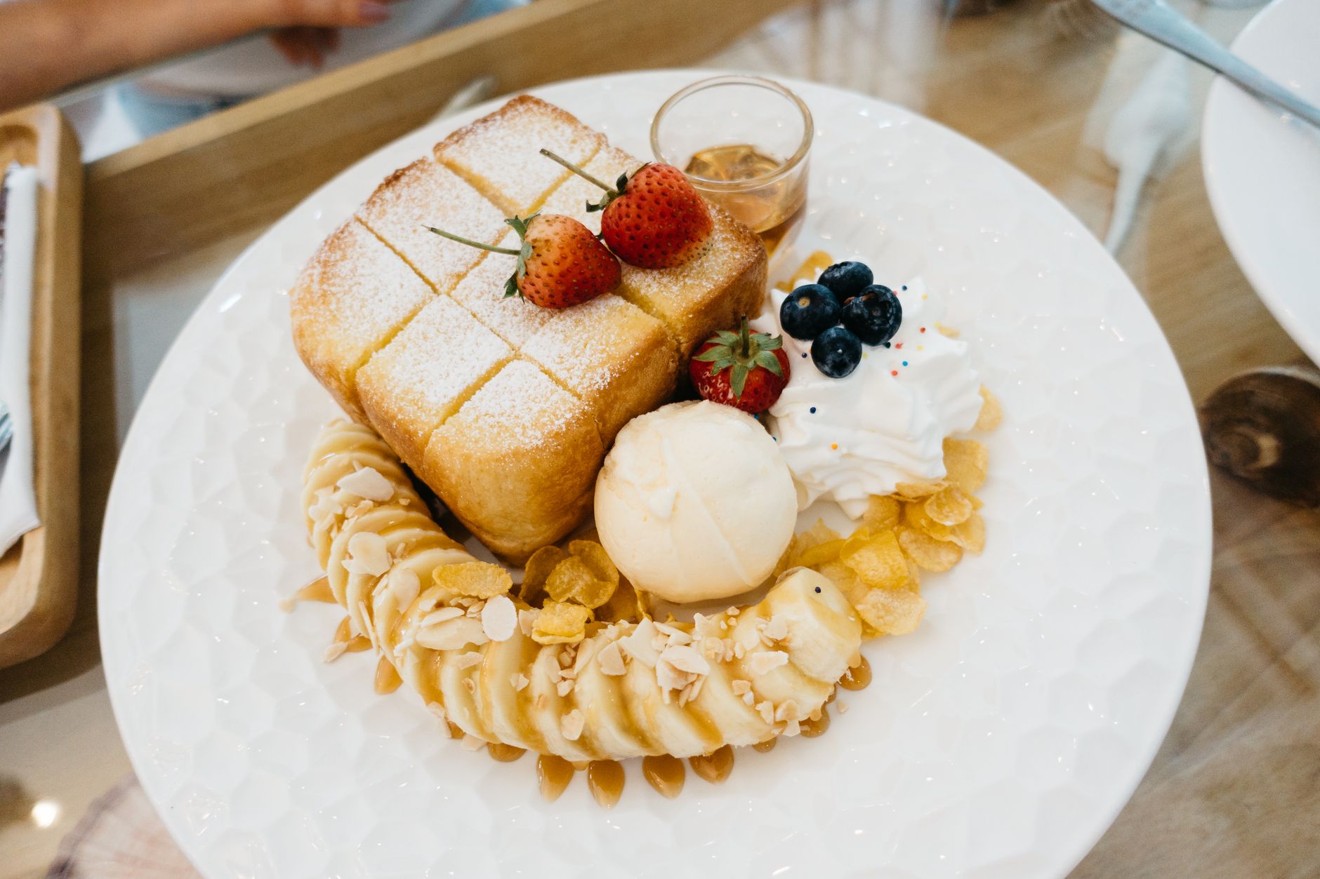 Freshly cooked French toast stacked on plate