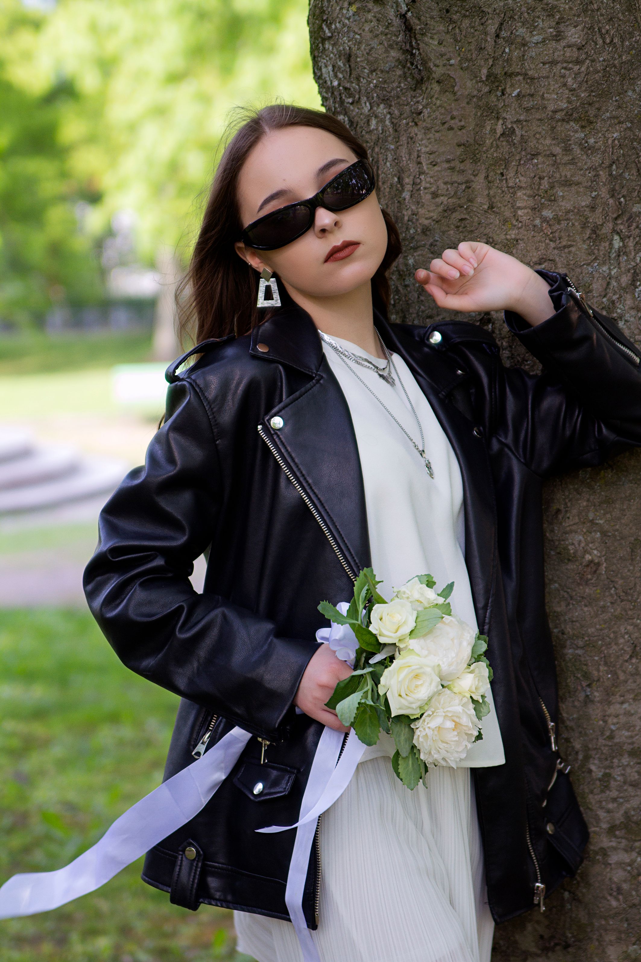 Woman in Black Leather Jacket Holding White Flower Bouquet · Free Stock ...