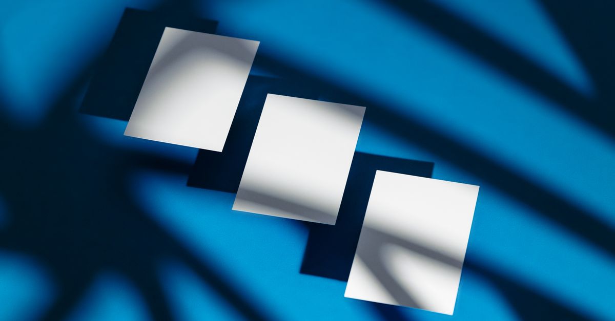 Paper Background Small Small Paper Sheets on Blue Background · Free Stock Photo