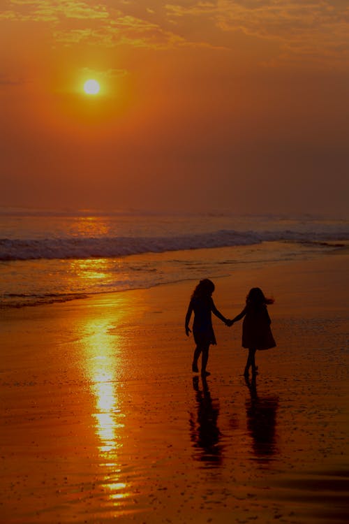 Young Girls Walking on the Beach