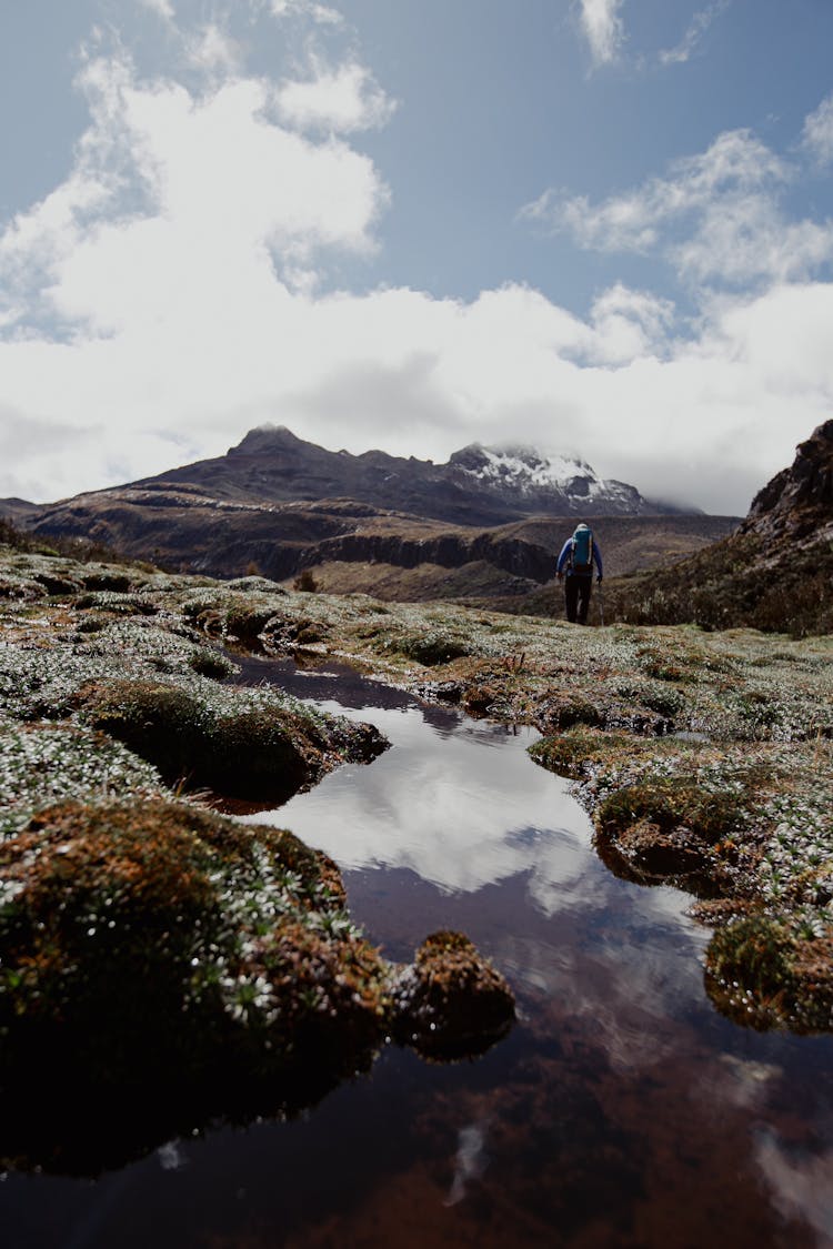 A Person Hiking A Mountain