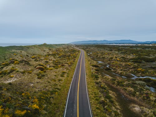 Foto profissional grátis de aéreo, asfalto, campo