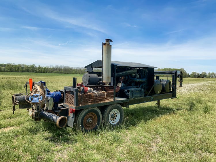 A Diesel Pump On A Grassy Field