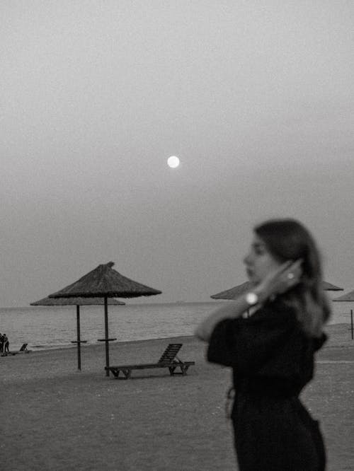 A Woman on the Beach at Dusk