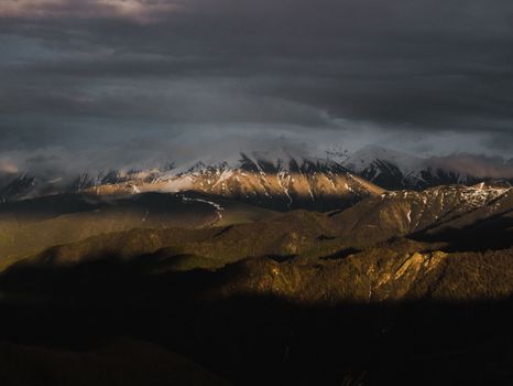 Stunning view of mountain range in Dagestan, Russia during daytime with dramatic shadows.