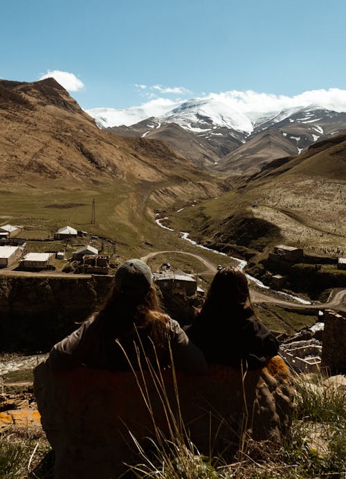 Couple Sitting and Looking at the Mountains 