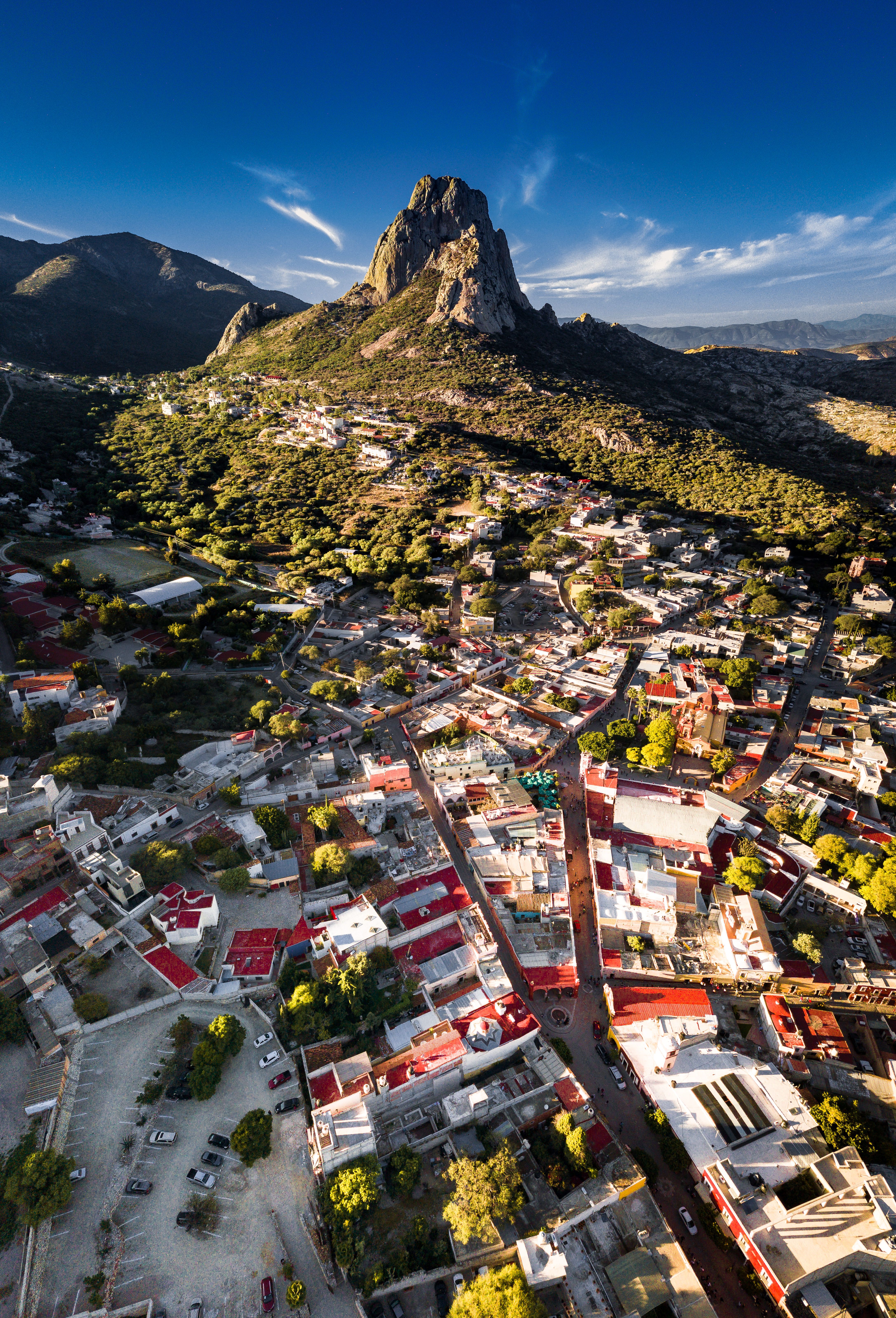 Stunning aerial view of Peña de Bernal and the colorful town of Bernal in Queretaro, Mexico.