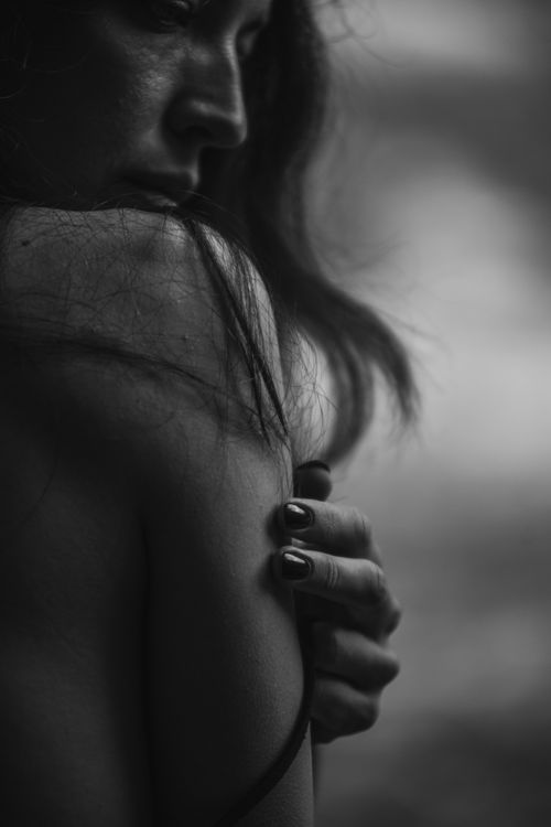 Free Artistic black and white close-up portrait of a woman with expressive emotion. Stock Photo