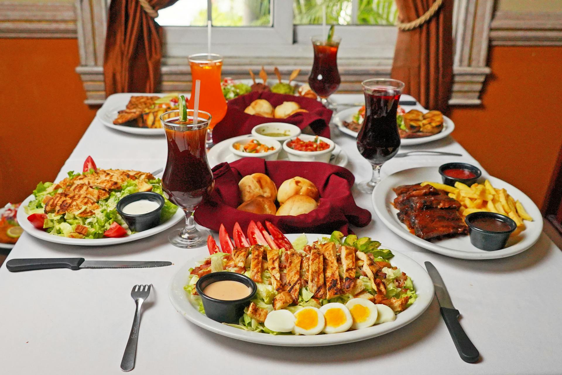 A colorful array of traditional El Salvadorian dishes on a table, perfect for food blogs.