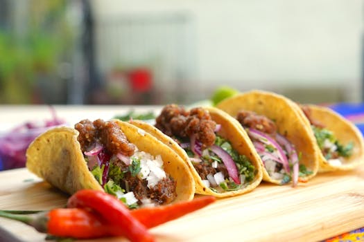 Close-up of tasty beef tacos with onions and cilantro, perfect for Mexican cuisine lovers.