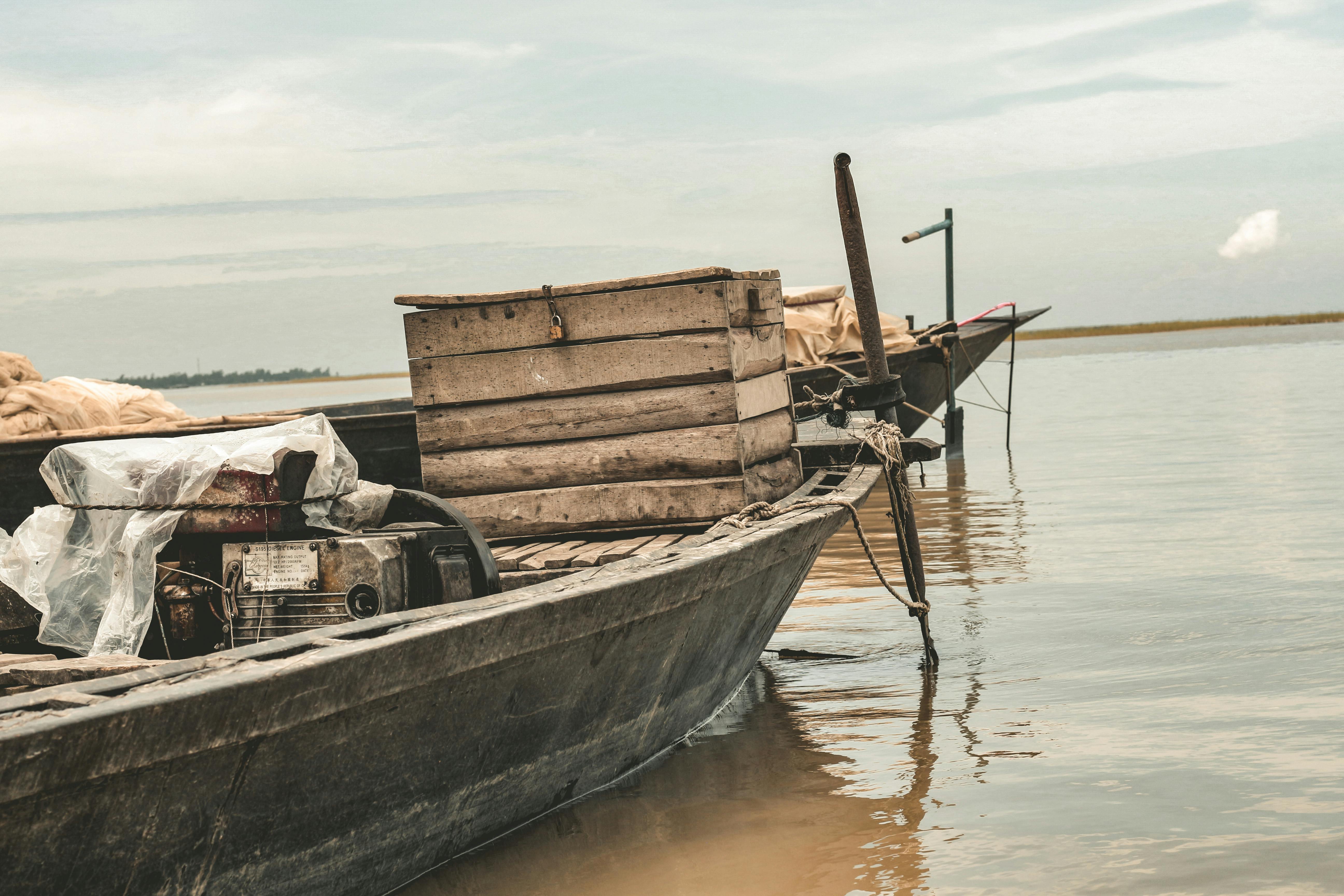 Old Wooden Boats with Crates on Water · Free Stock Photo