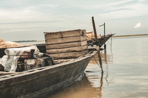 Old Wooden Boats with Crates on Water