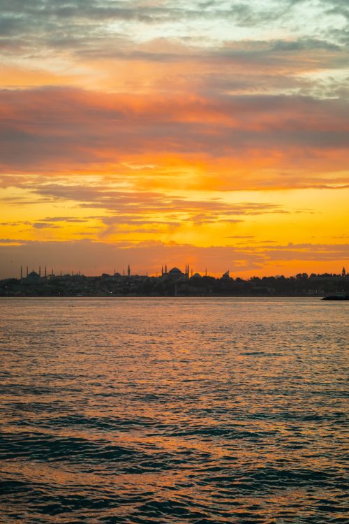 Free Vibrant sunset over the Bosphorus, capturing Istanbul's iconic skyline silhouette. Stock Photo