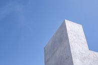 Gray Concrete Wall Under Clear Blue Sky