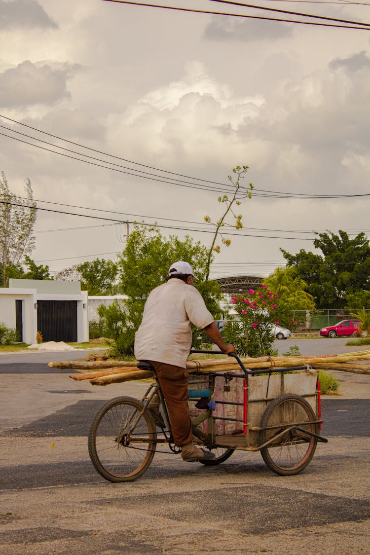 Man Riding A Tricycle