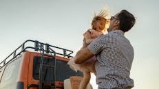 Father Picking Up His Daughter