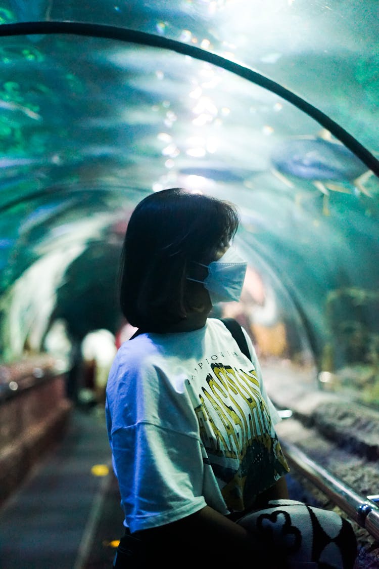 Woman Beneath A Glass Aquarium