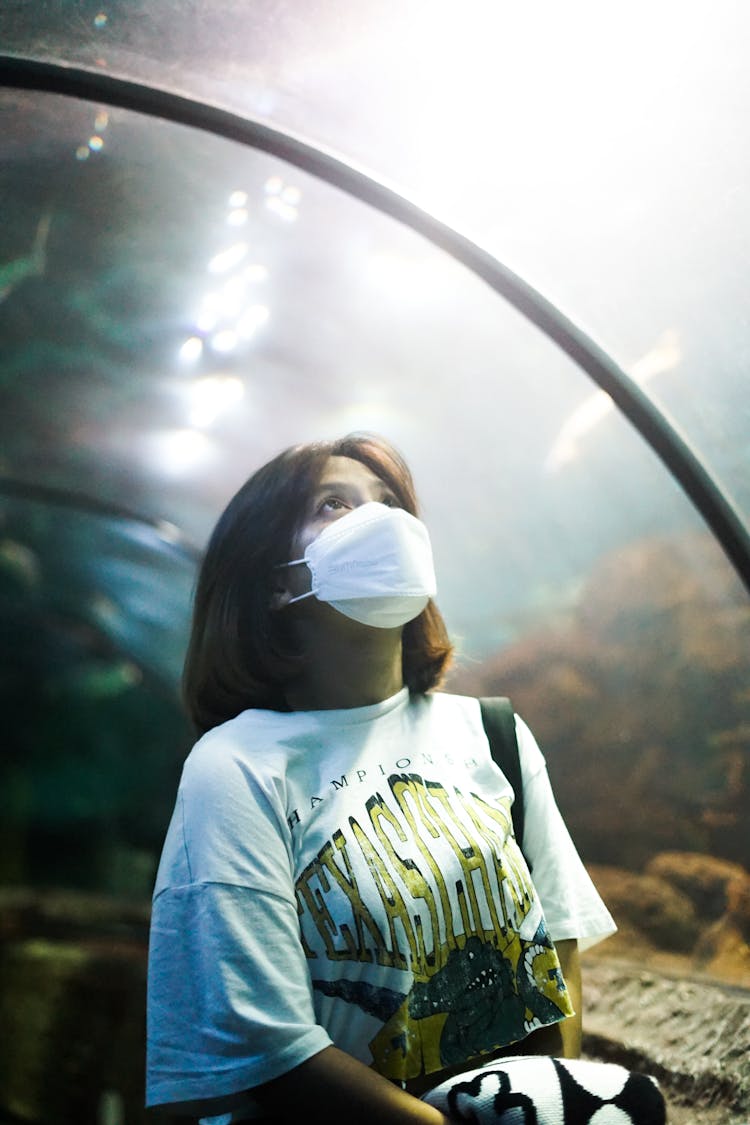 Woman In White Shirt Wearing A Facemask