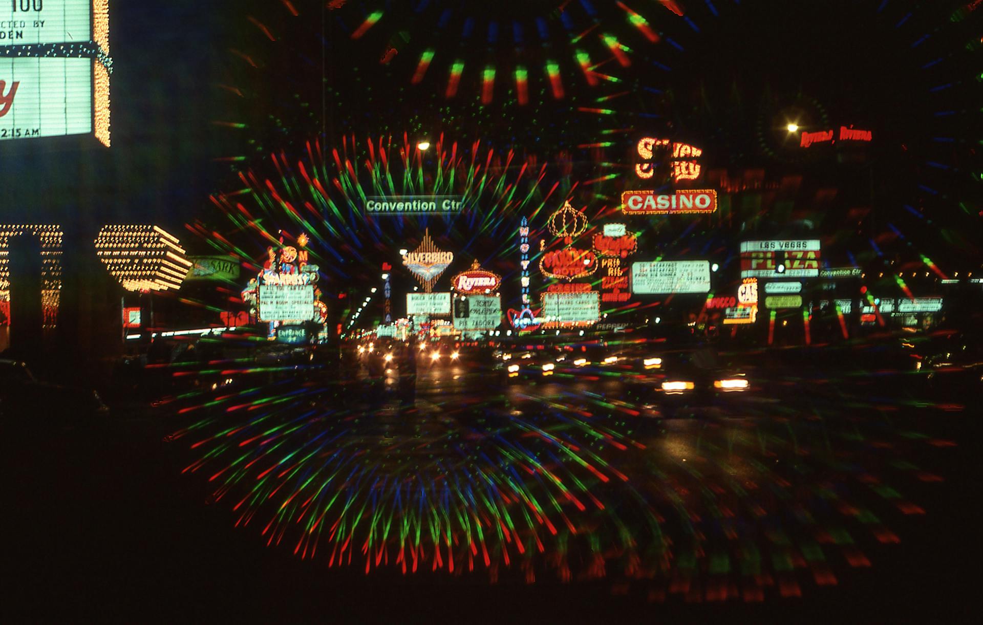 Explore the vibrant neon-lit streets of downtown Las Vegas at night, featuring casinos and bustling nightlife.