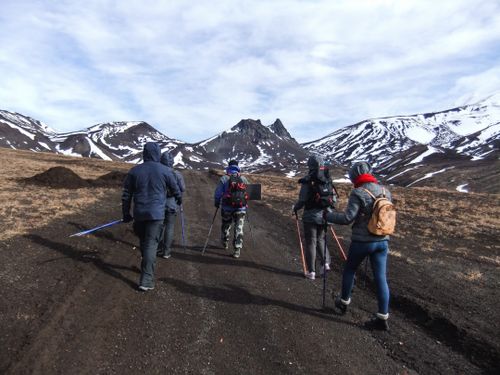 Free A group of hikers trekking on a snow-capped mountain trail, showcasing outdoor adventure and natural beauty. Stock Photo