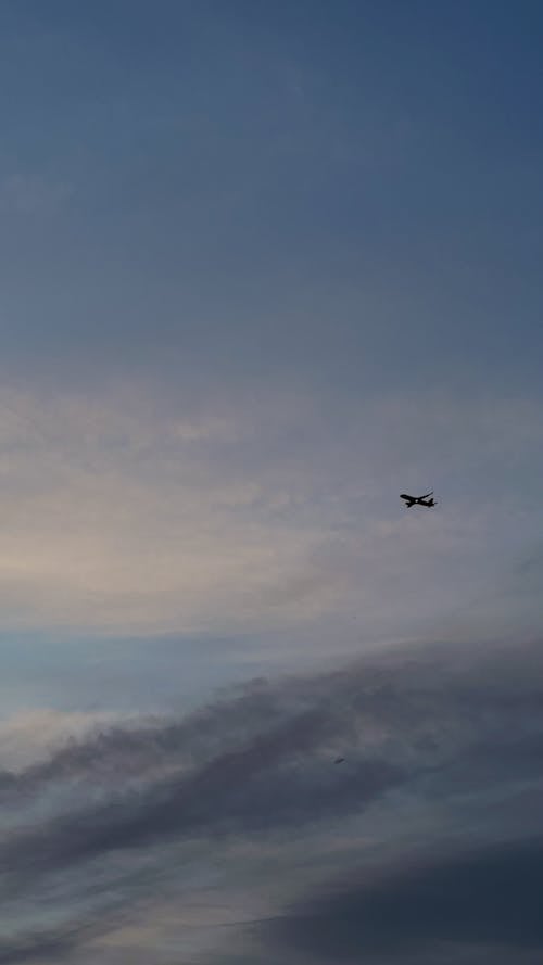 Silhouette of an Airplane in the Sky