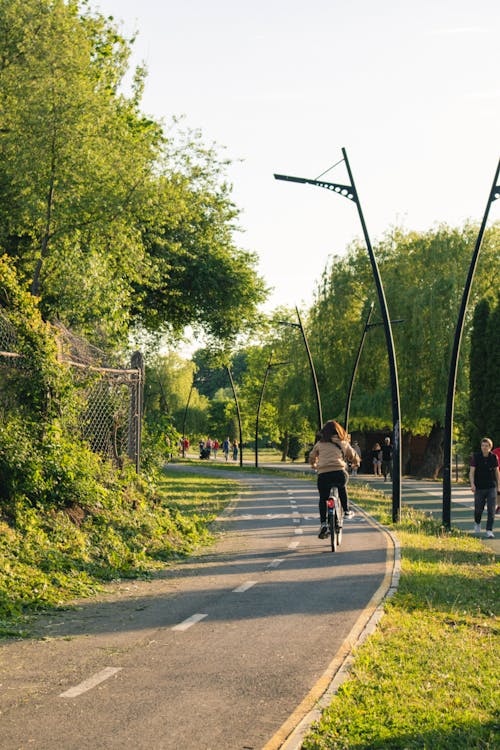 Photo of a Woman Riding a Bike