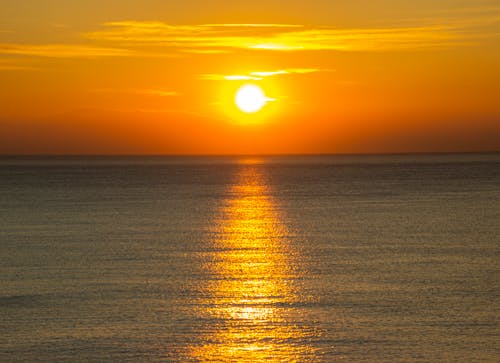 Kostnadsfri bild av gyllene timmen, hav, orange himmel